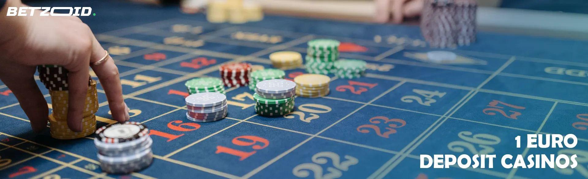 A player puts chips on the casino table.