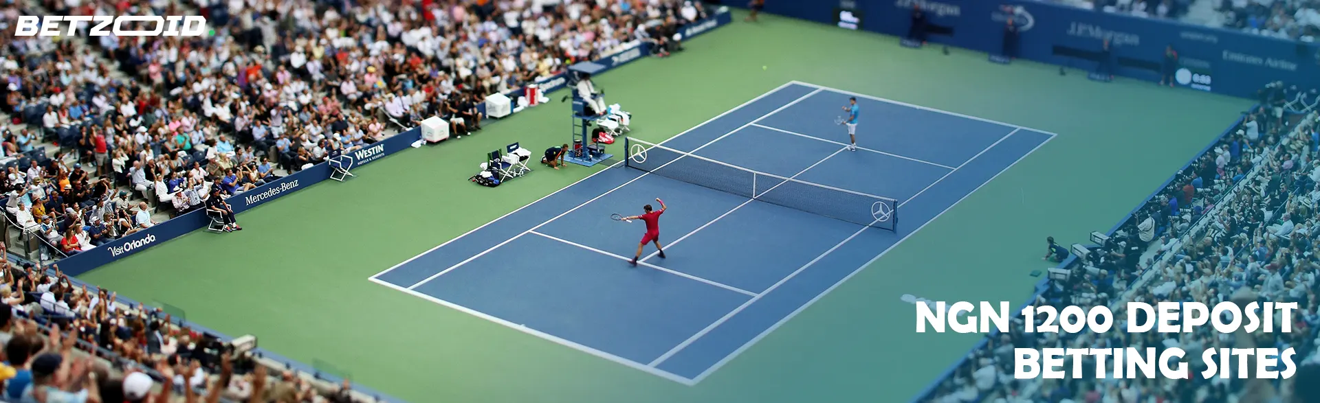 A tennis match in front of spectators in a large arena.