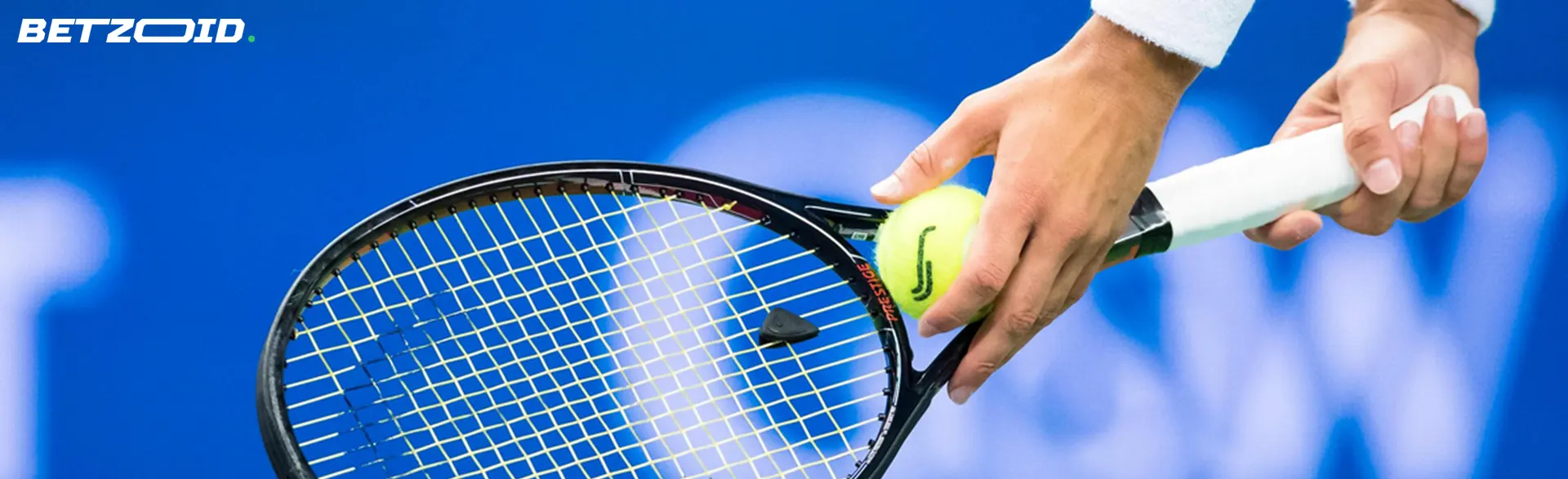 The tennis player applies the ball to the racket.