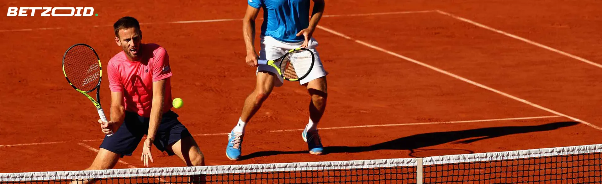 Two tennis players in action during a match.