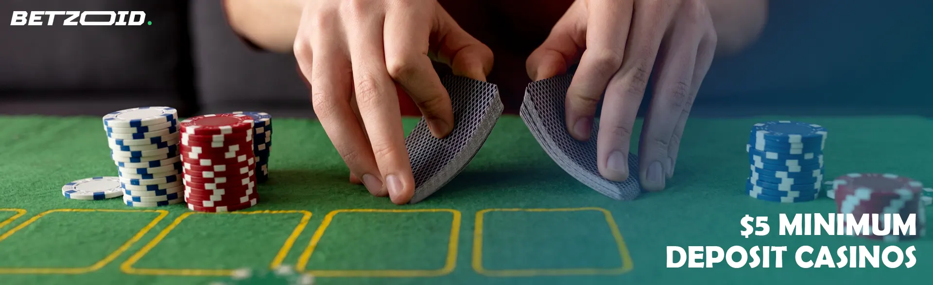 The player shuffles the cards next to the casino chips.