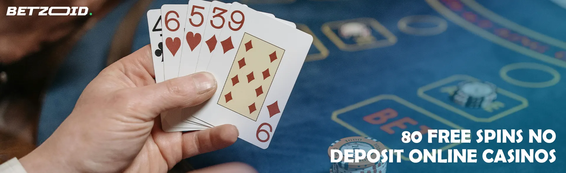 The player is holding cards on the background of the casino table.