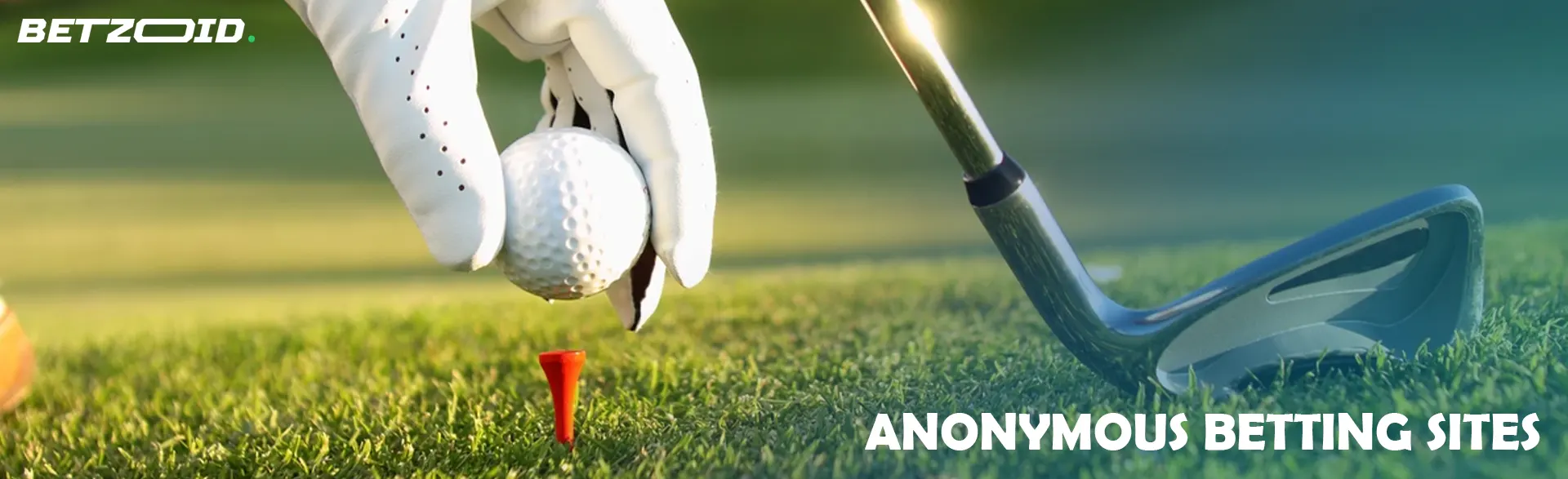 A golfer places the ball for a shot.