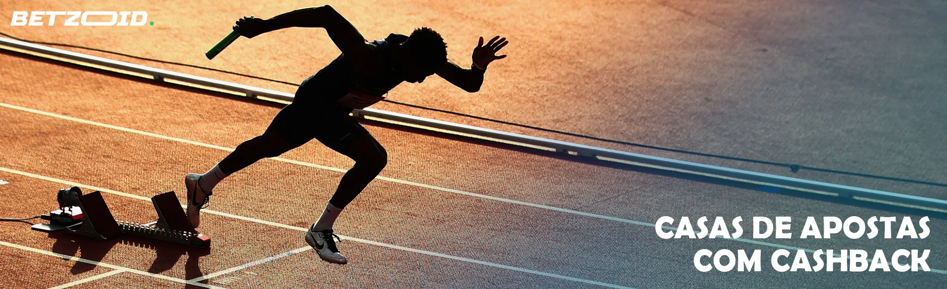 Um corredor começa numa pista de corrida.