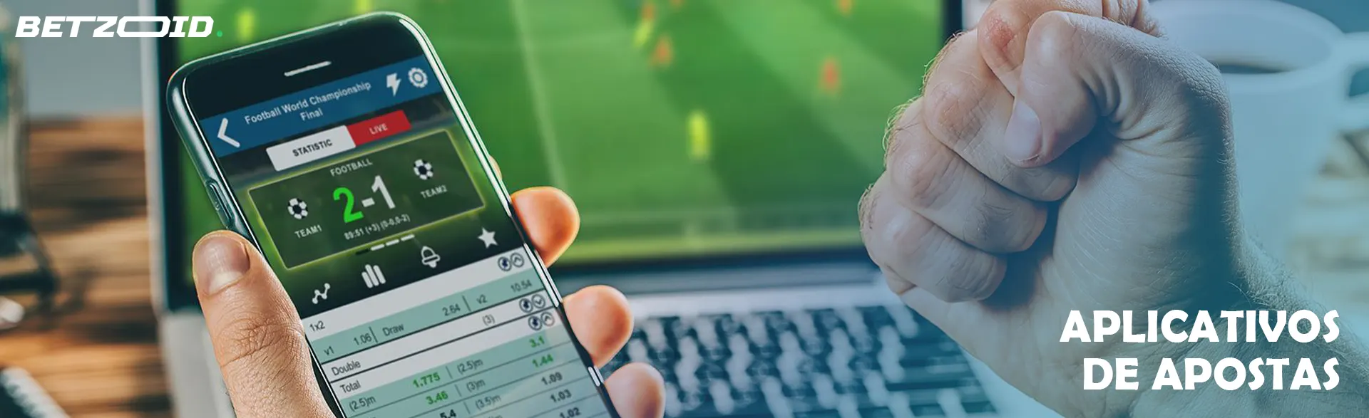 Um homem segura um smartphone com um aplicativo de apostas.