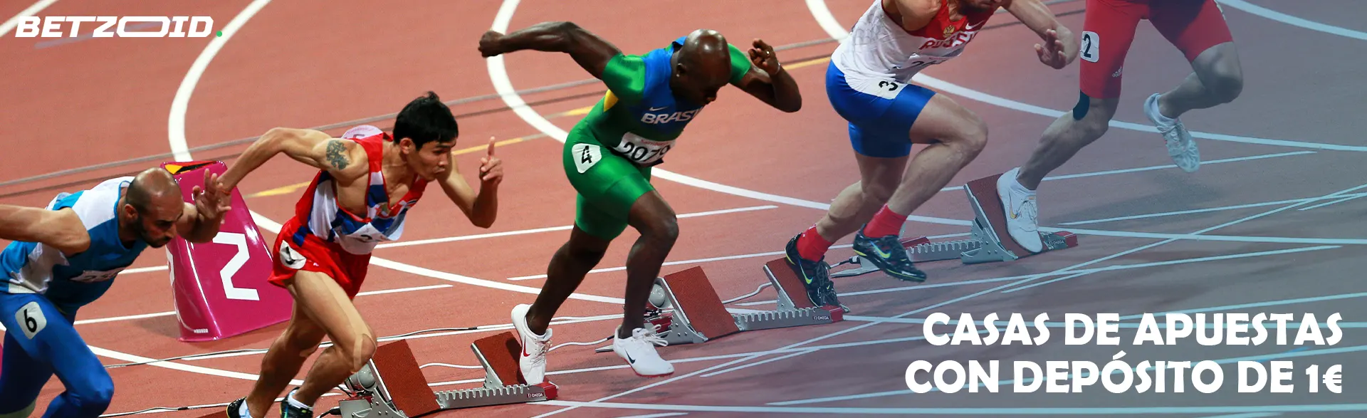 Varios deportistas empiezan a correr por la pista del estadio.