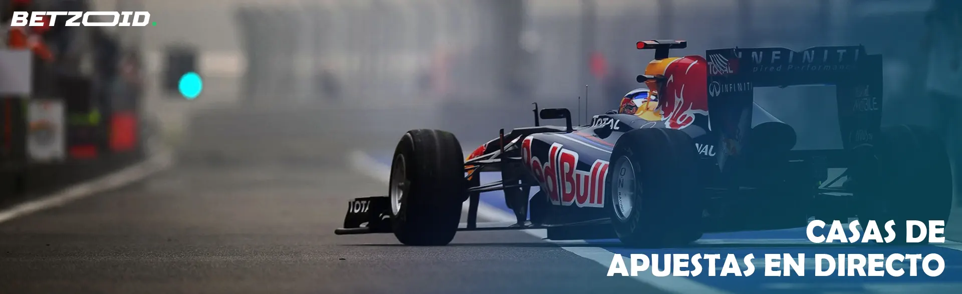 Un grupo de jinetes a caballo durante una carrera de caballos.