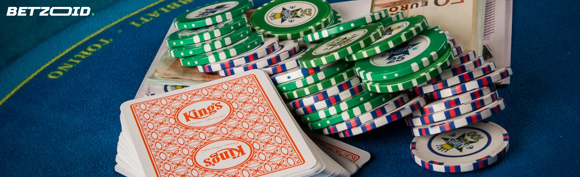 Pile of cards and chips on the casino table.