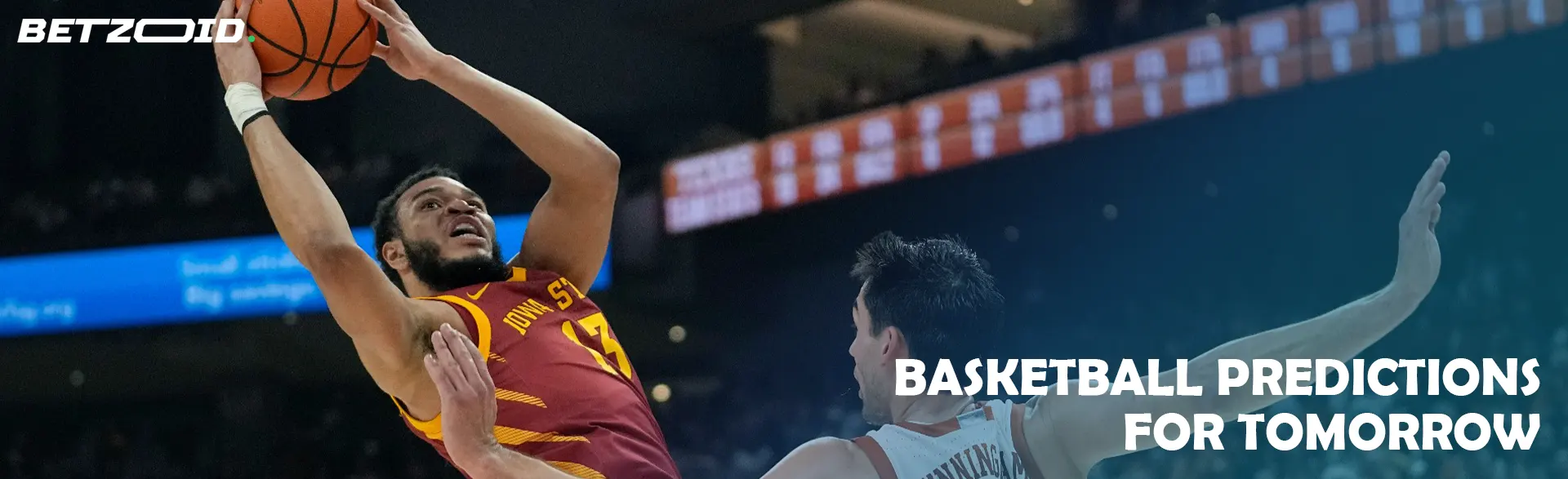 Basketball players fight for the ball during the game.