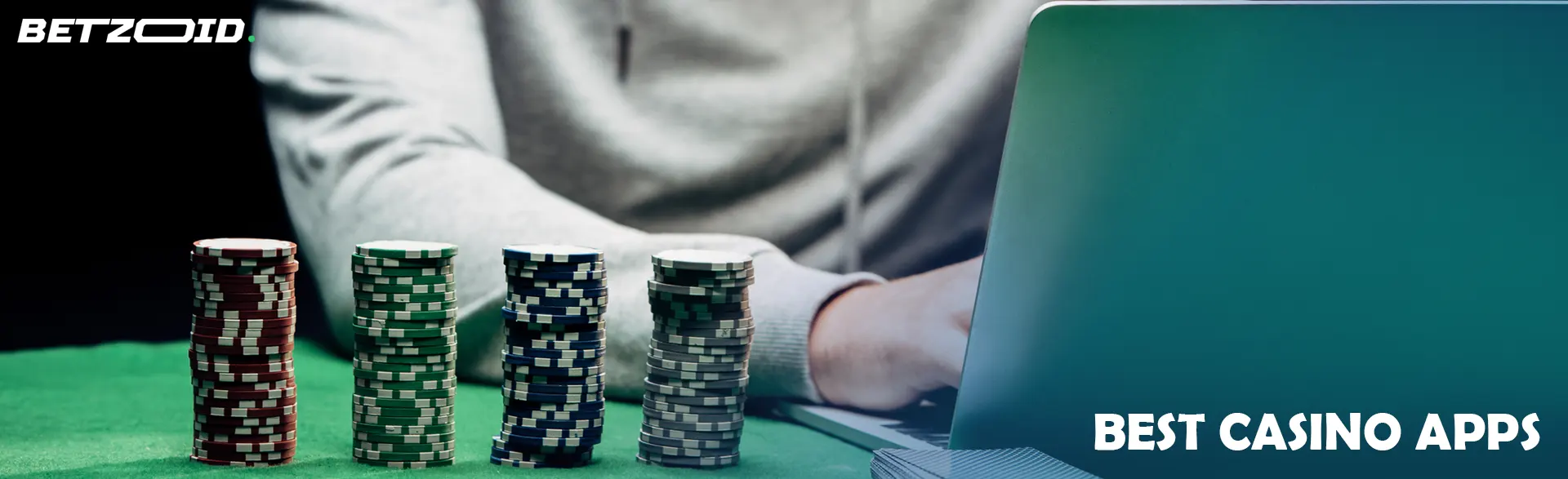 The player behind the laptop next to the casino chips.