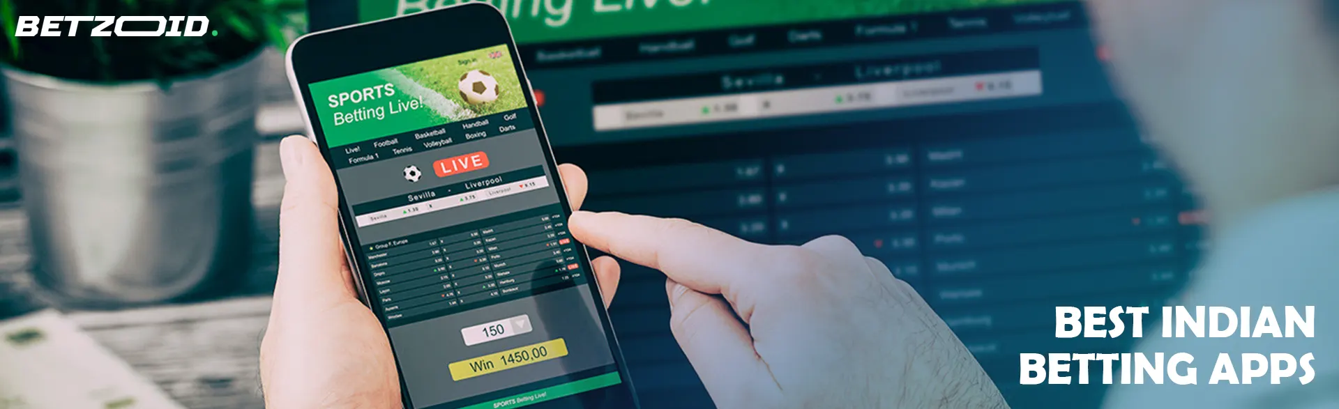 A man is holding a smartphone with a betting application.