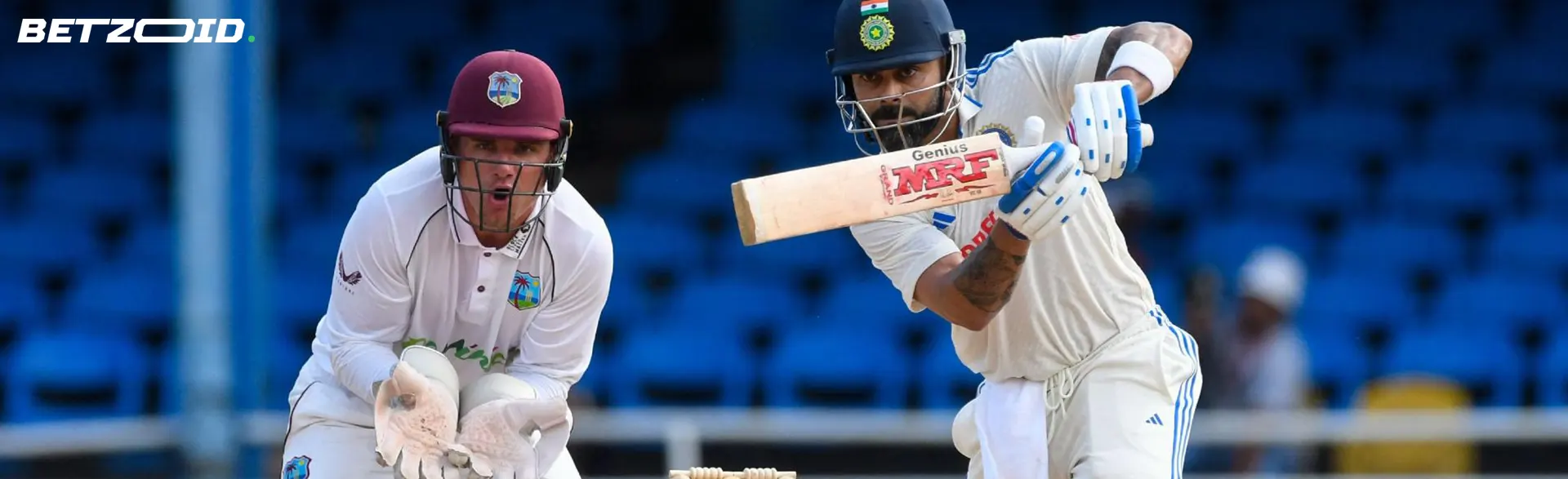A cricketer prepares to hit the ball.