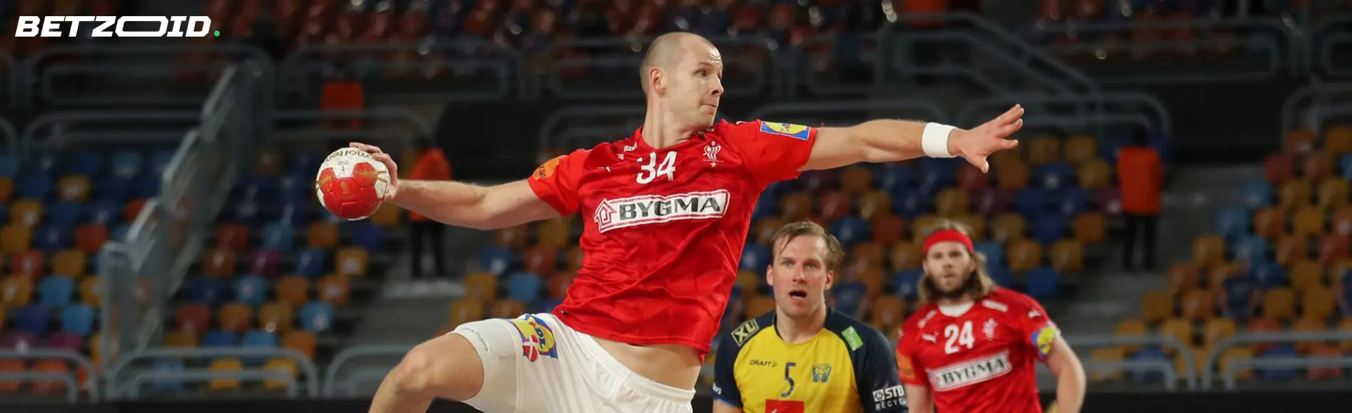 Håndboldspiller med en bold under en kamp.