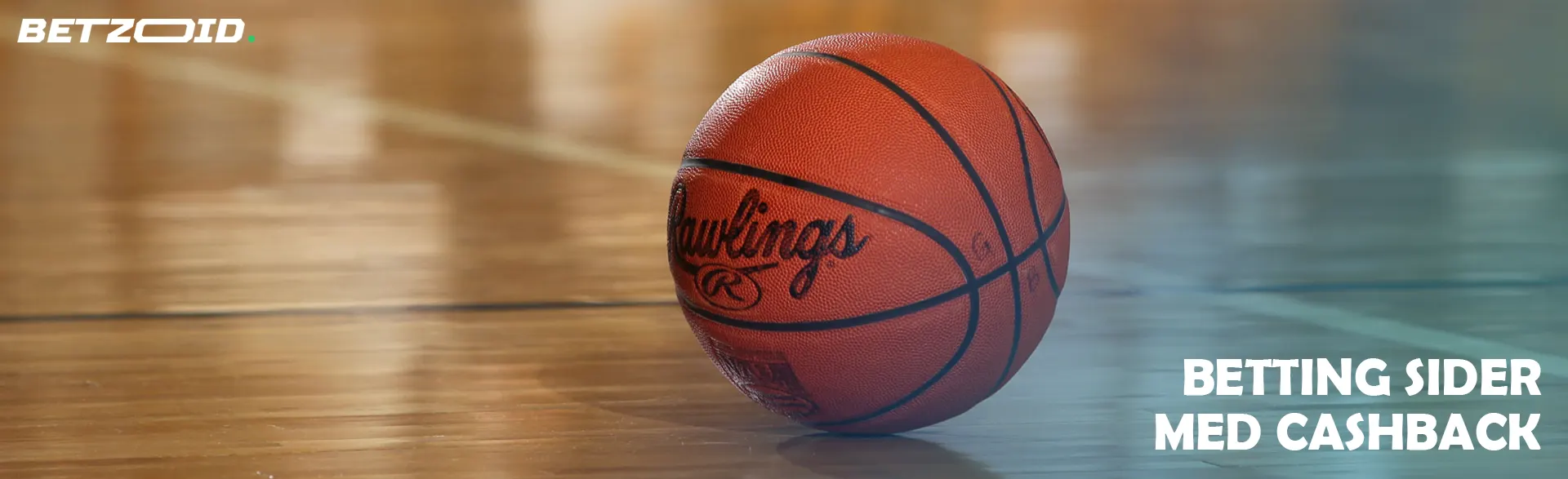 Basketbolden ligger på gulvet.