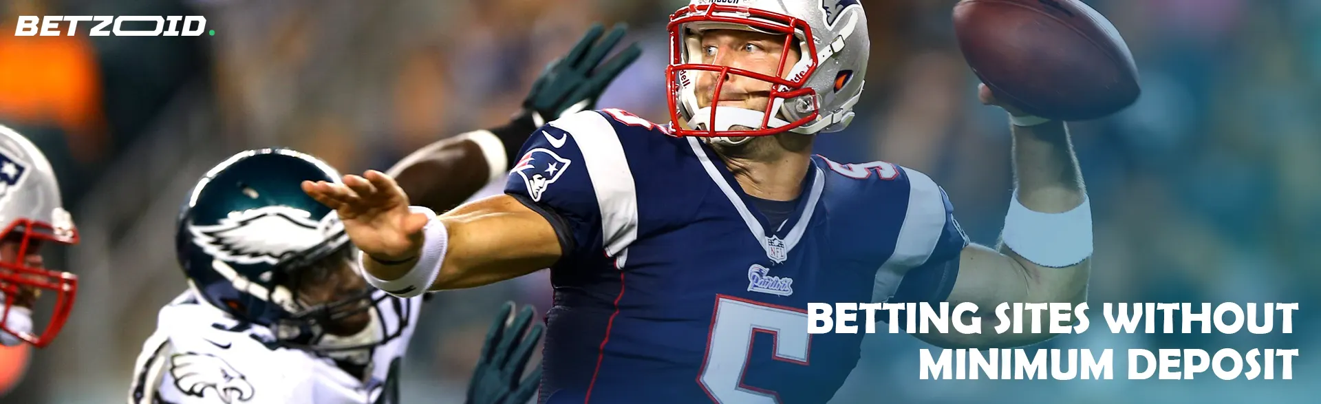 An American football player passes the ball during a game.