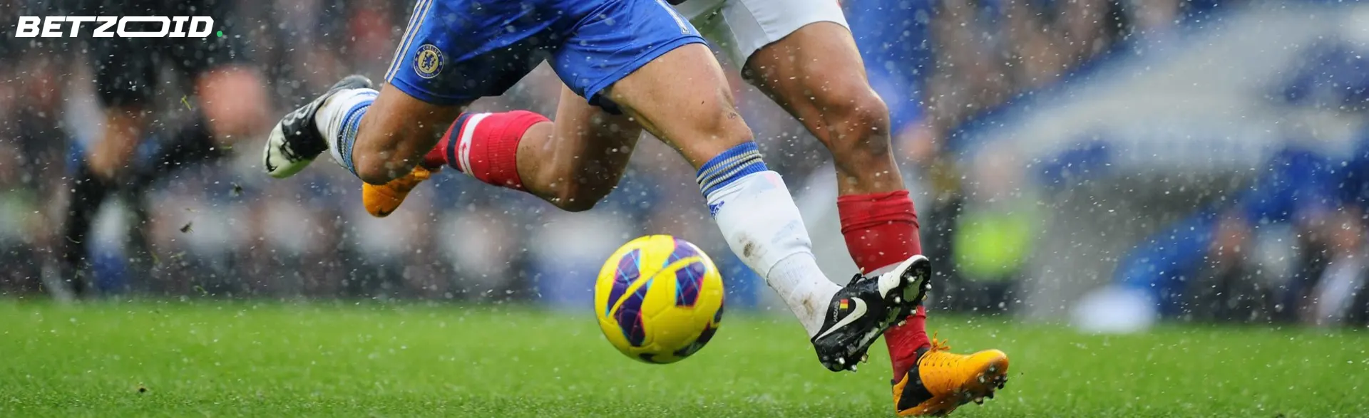 Football players fight for the ball during the match.