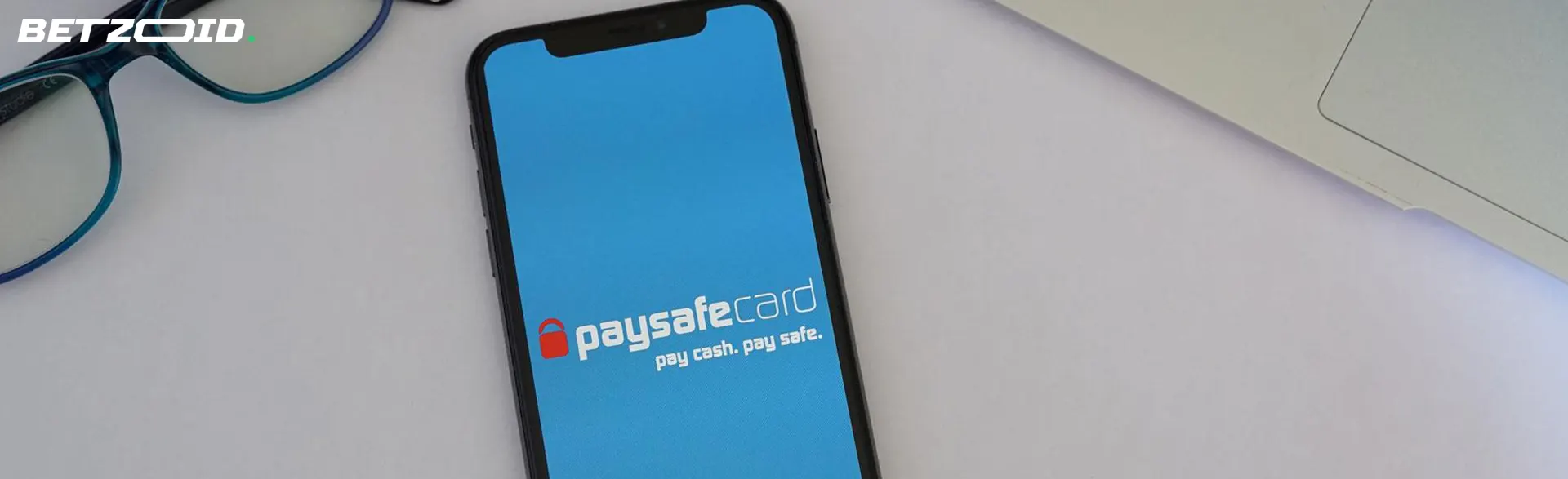 Smartphone with Paysafecard logo.