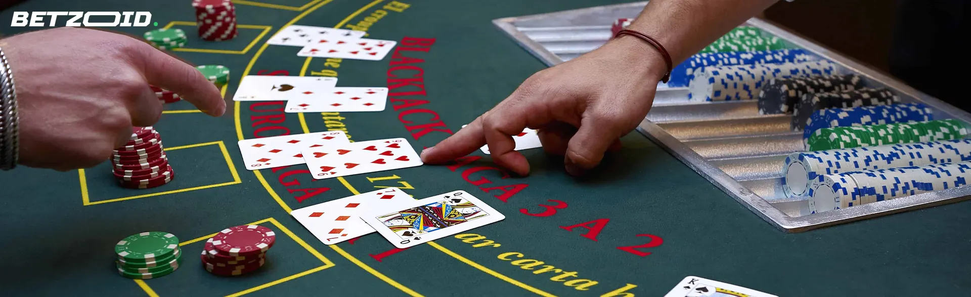 The player points to the cards lying on the casino table.