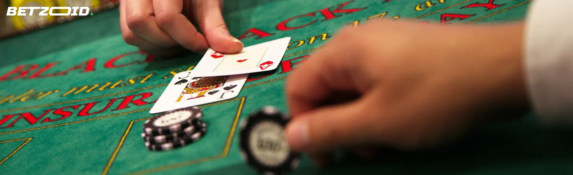 The player places cards on the casino table.