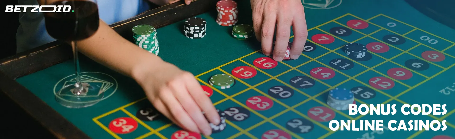 Players place bets on a roulette table.