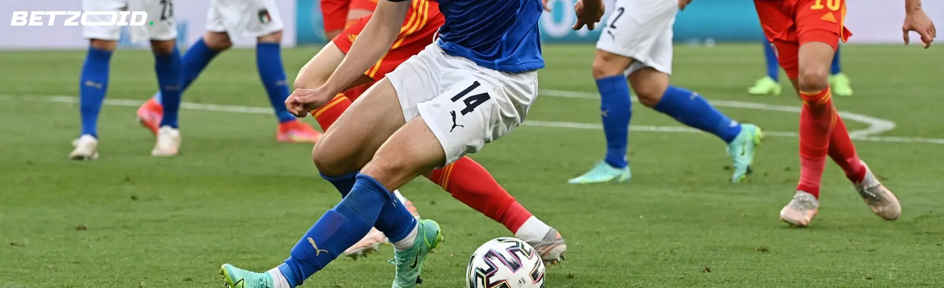 Football players fight for the ball during the match.