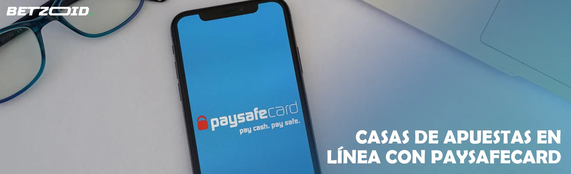 Smartphone con aplicación Paysafecard en pantalla.
