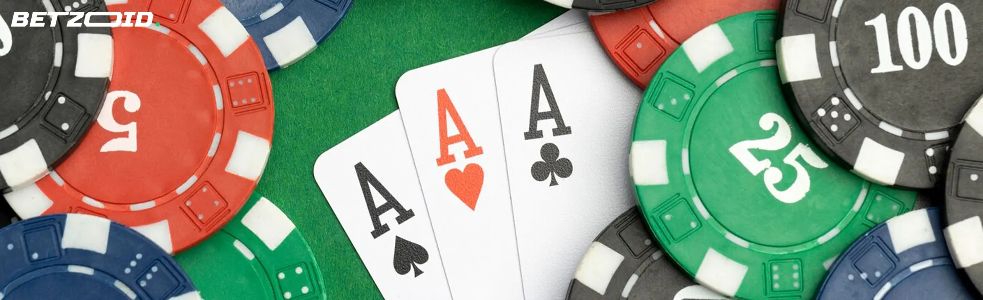 Three cards are surrounded by casino chips.