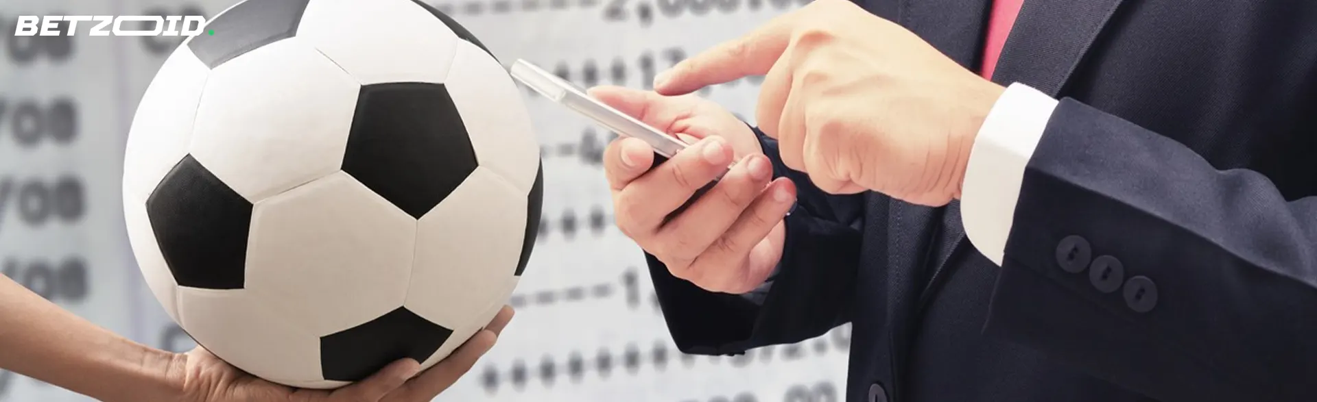 A man stands in front of a soccer ball and makes bets.