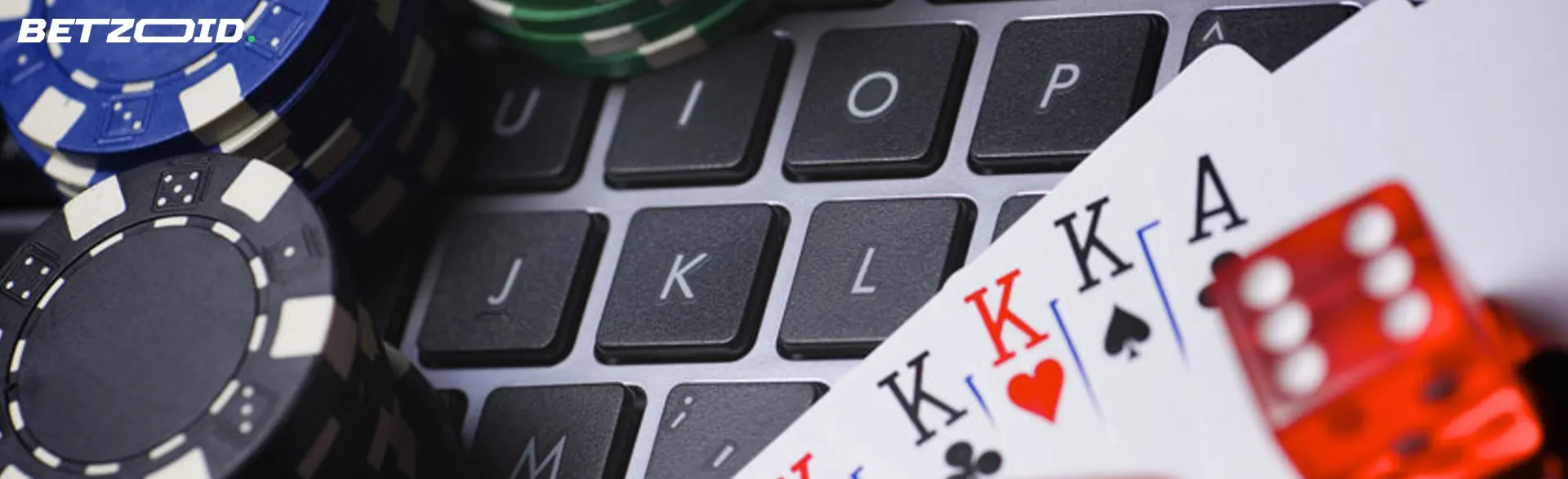 Casino chips, cards and dice on the keyboard.