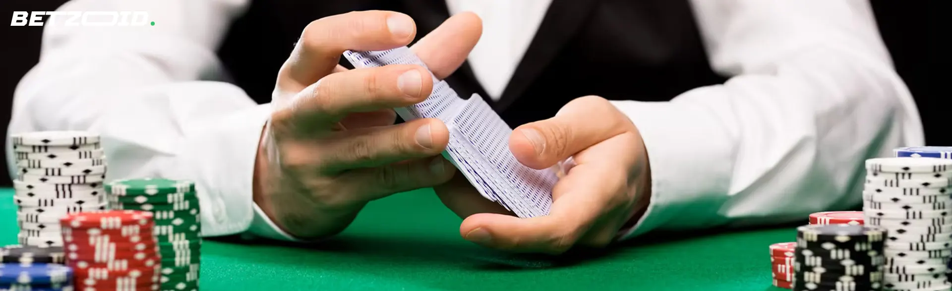 Croupier barajando cartas en mesa de casinos con factura telefónica.