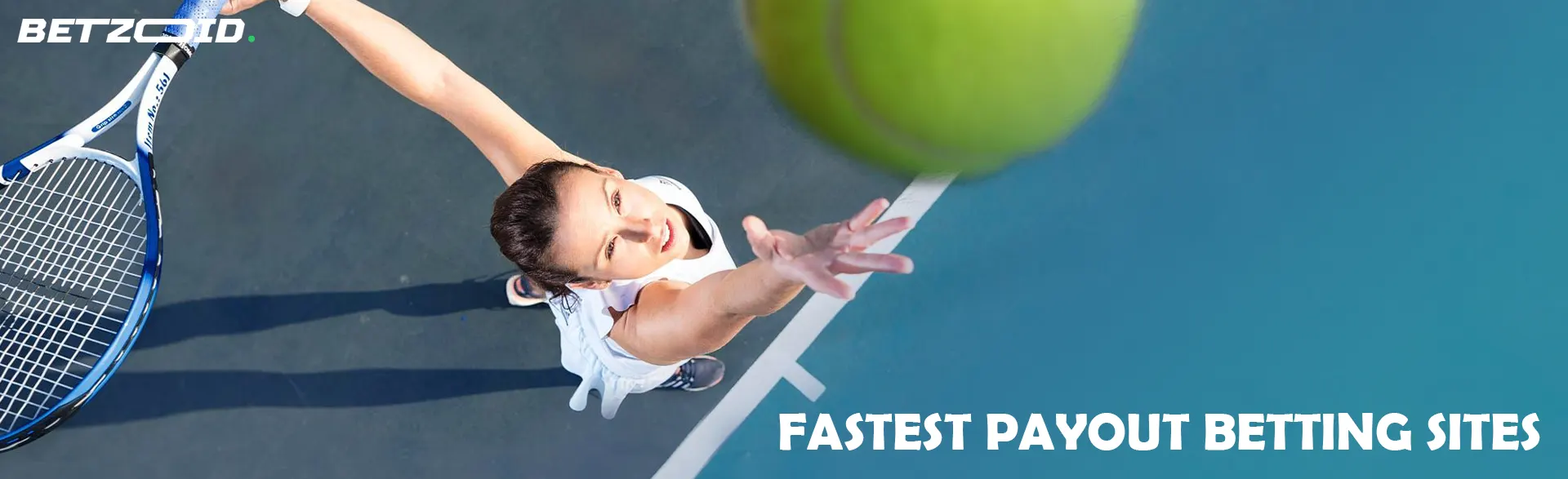 Female tennis player serves the ball on the court from above.