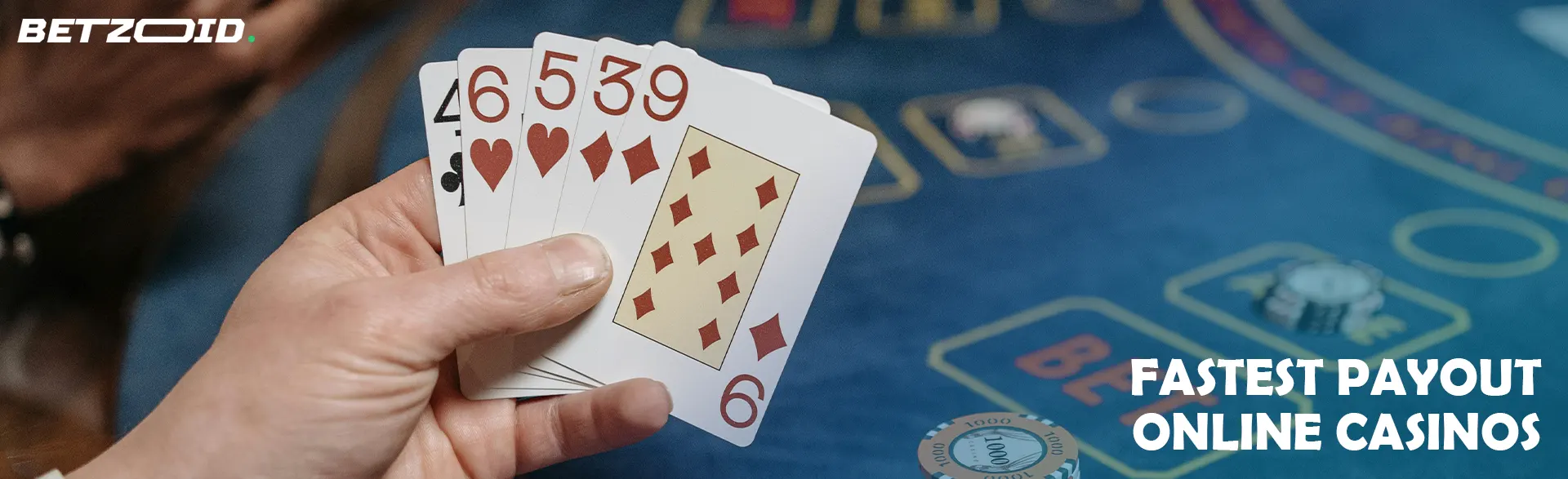 The player is holding cards on the background of the casino table.