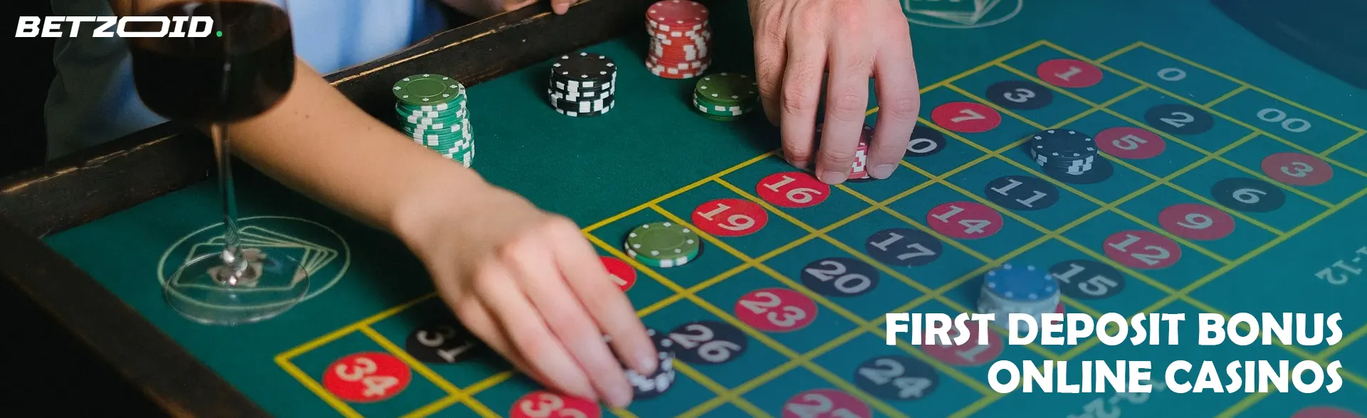 Players place bets with chips on the casino table.