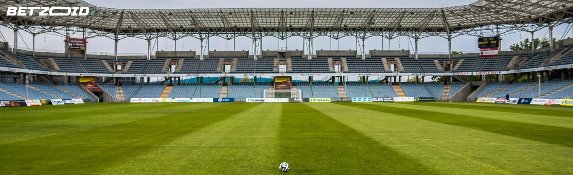 Empty football stadium with ball.