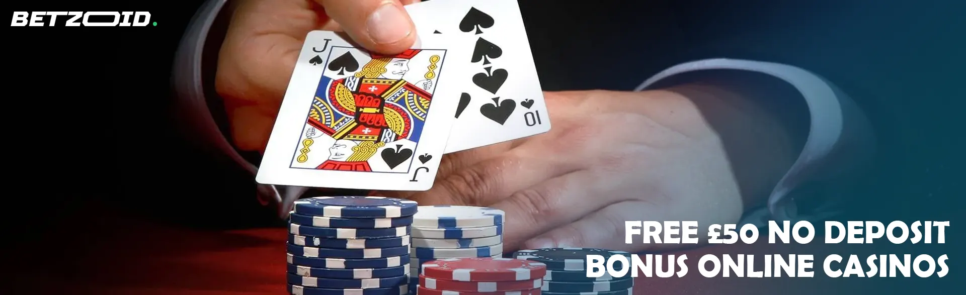 The player holds the cards above the casino chips.