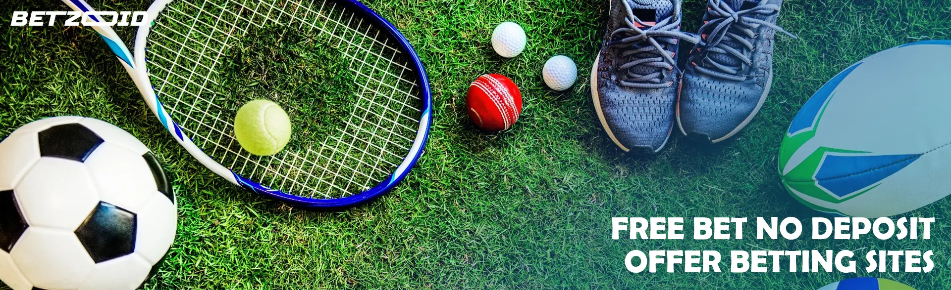 Different sports equipment lies on the grass.