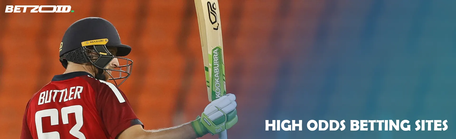 Cricketer with bat against the backdrop of stands.