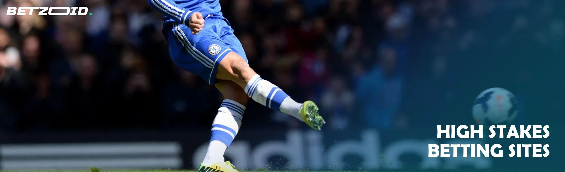 A football player kicks the ball during a match.