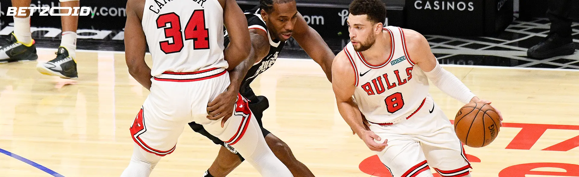 Basketball players in action during a game.