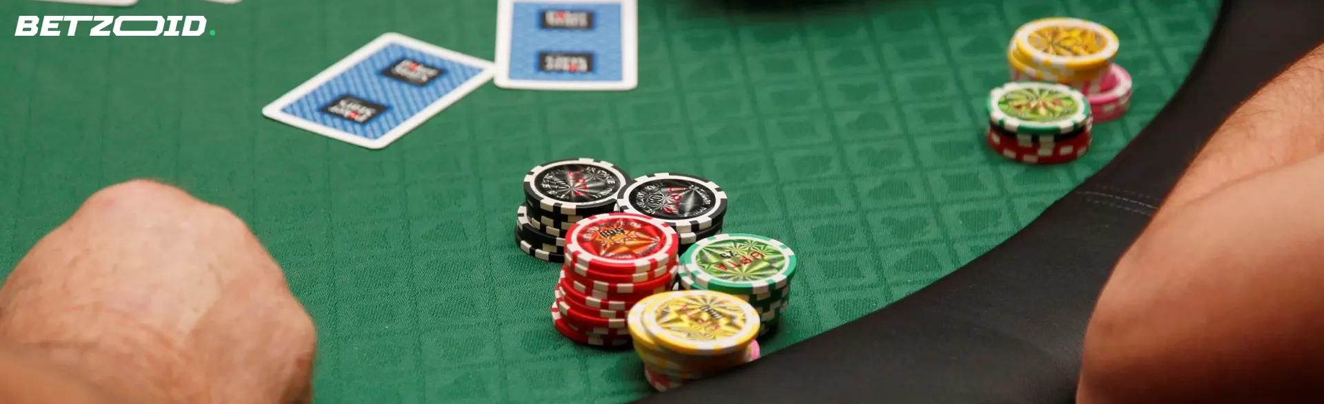 Cards and chips on the casino table.