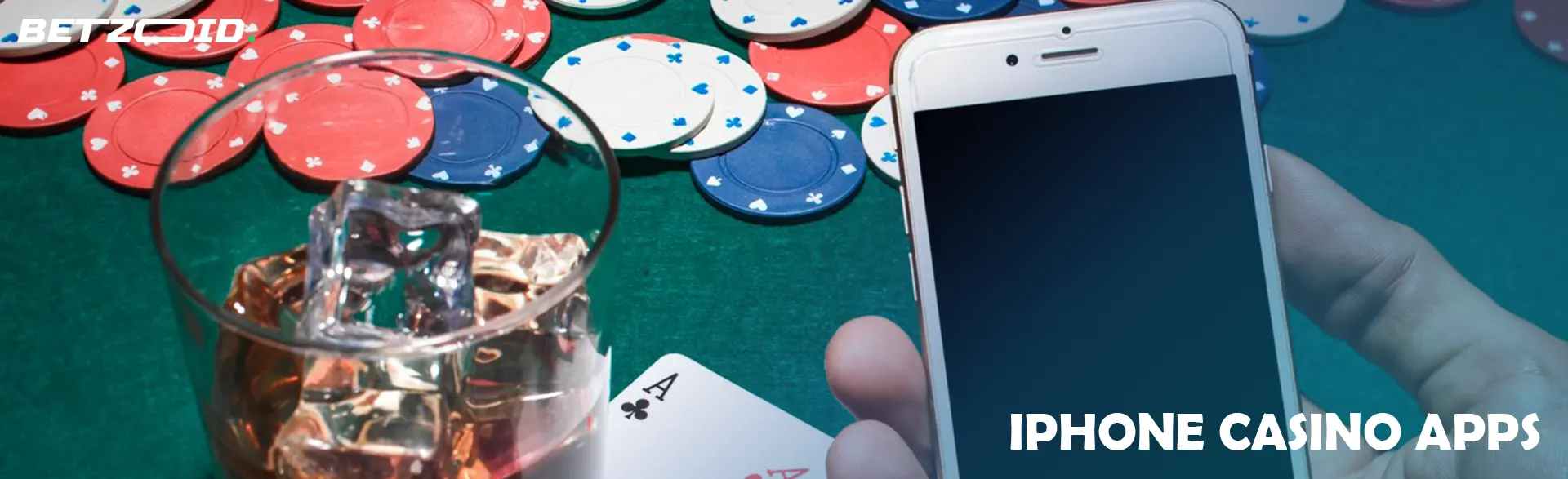 A smartphone next to casino chips and a drink in a glass.