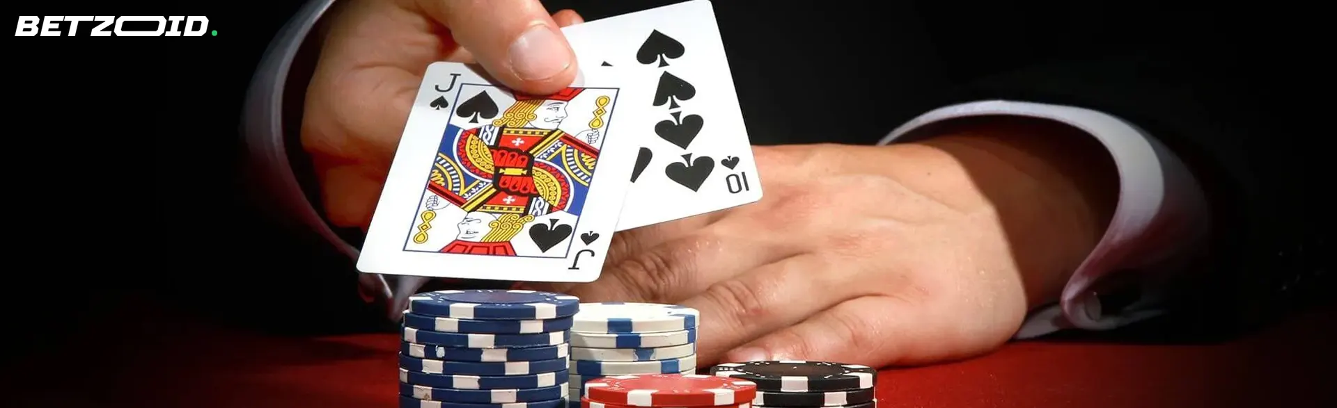 The player shows the cards next to the casino chips.