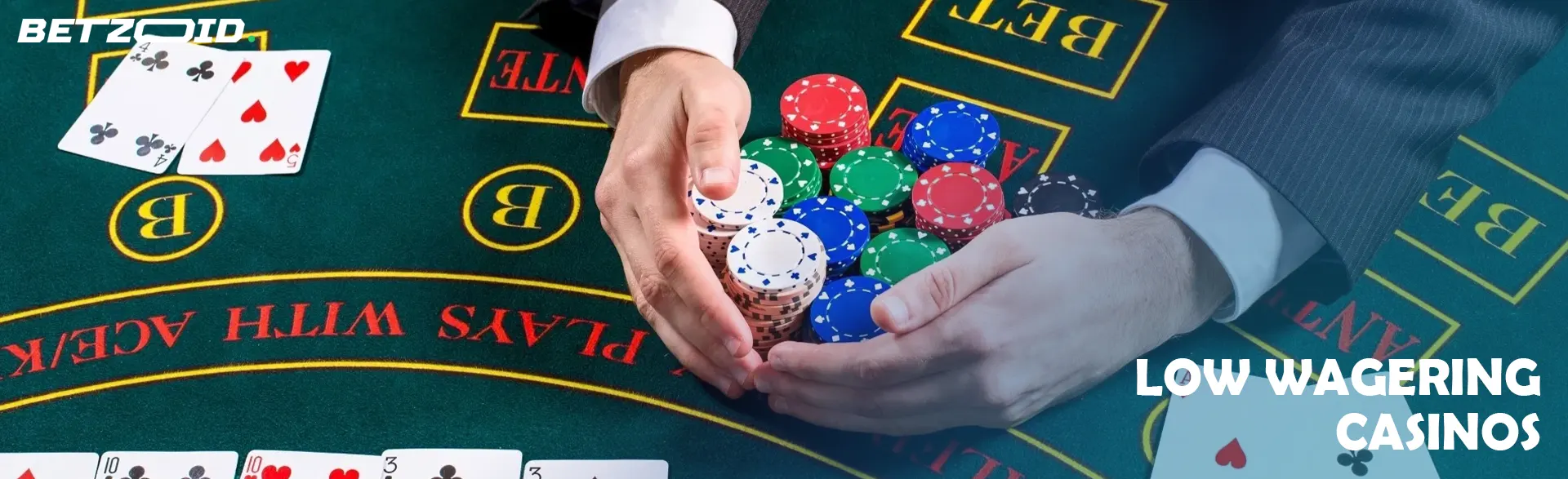 A player holds chips on the casino table.