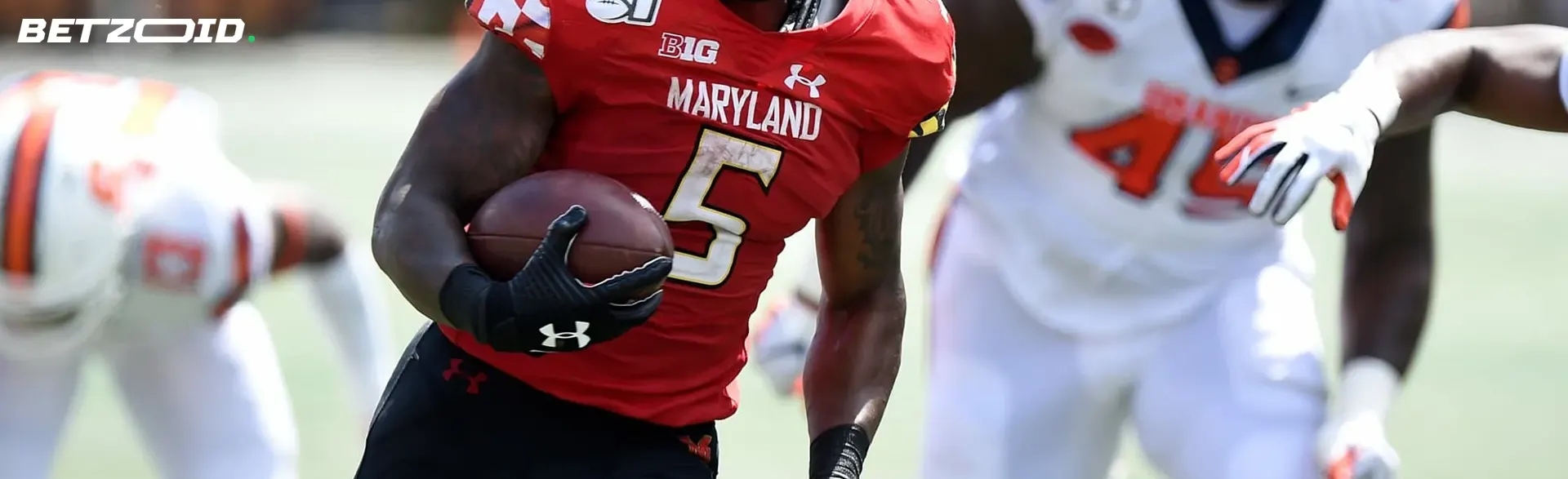 American football player with the ball during the match.