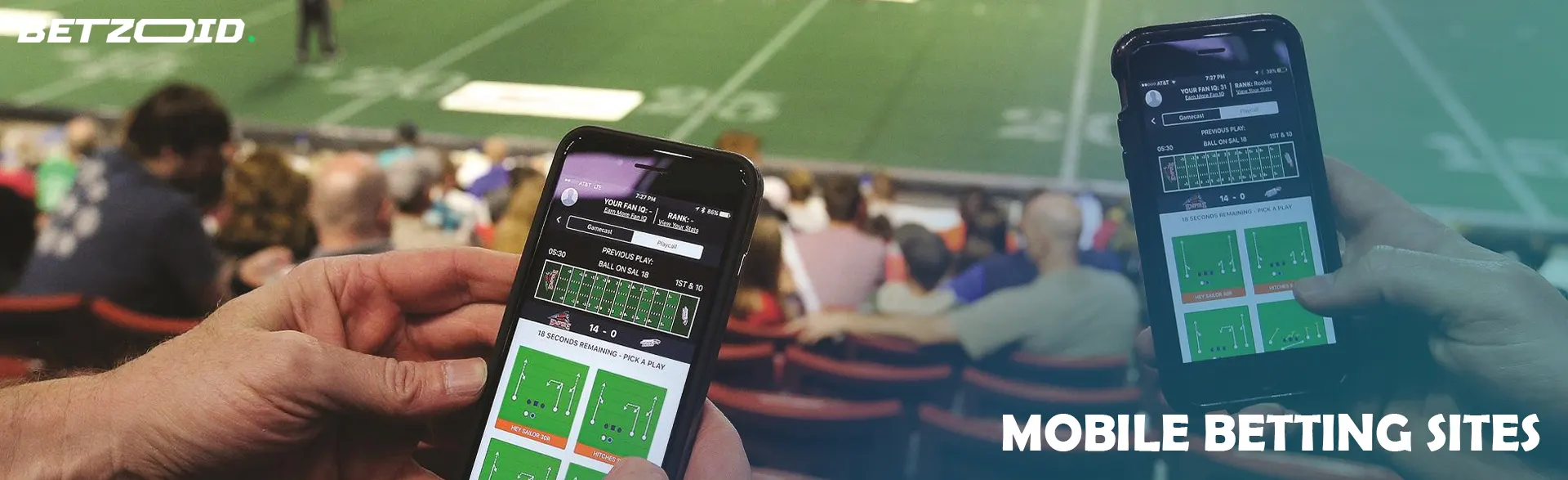 Smartphones in the hands of people in the stands.