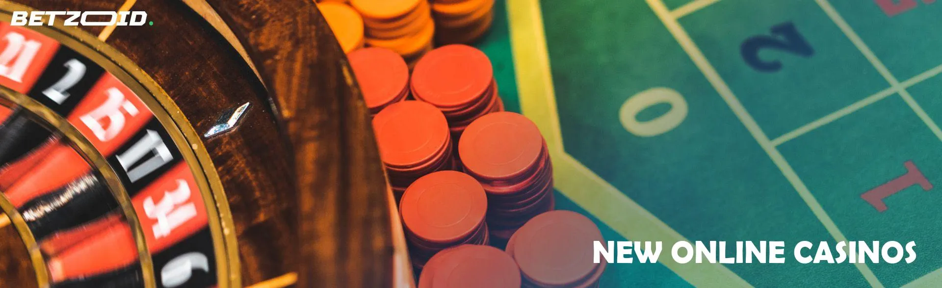Roulette wheel next to casino chips.