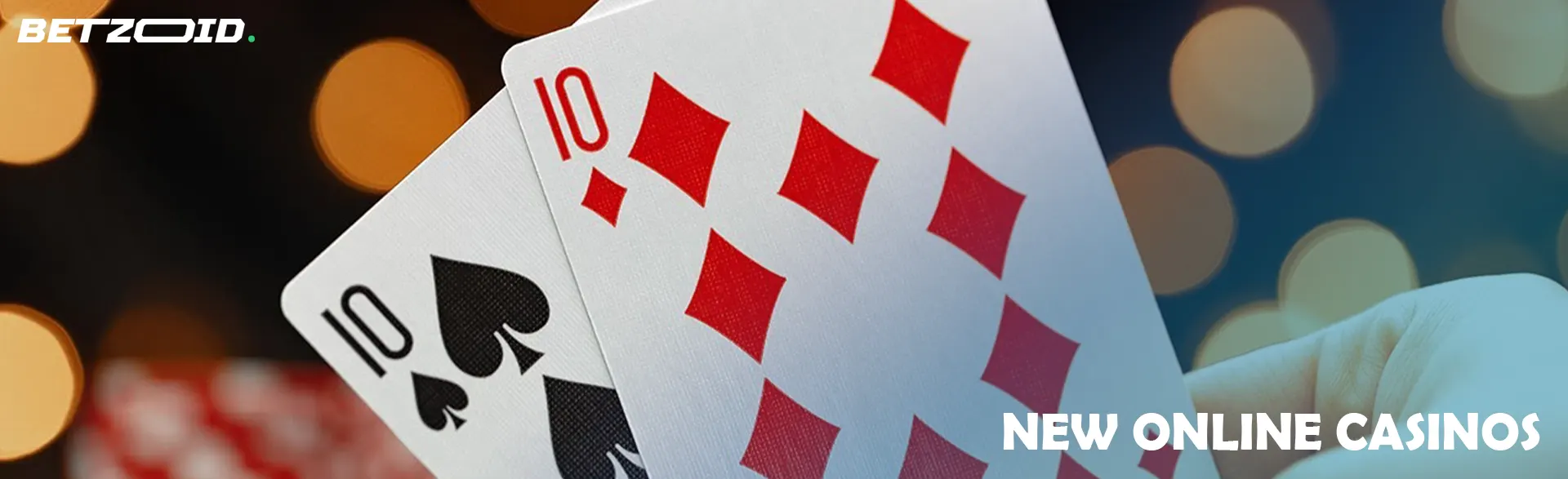 Two cards against the background of casino lights.