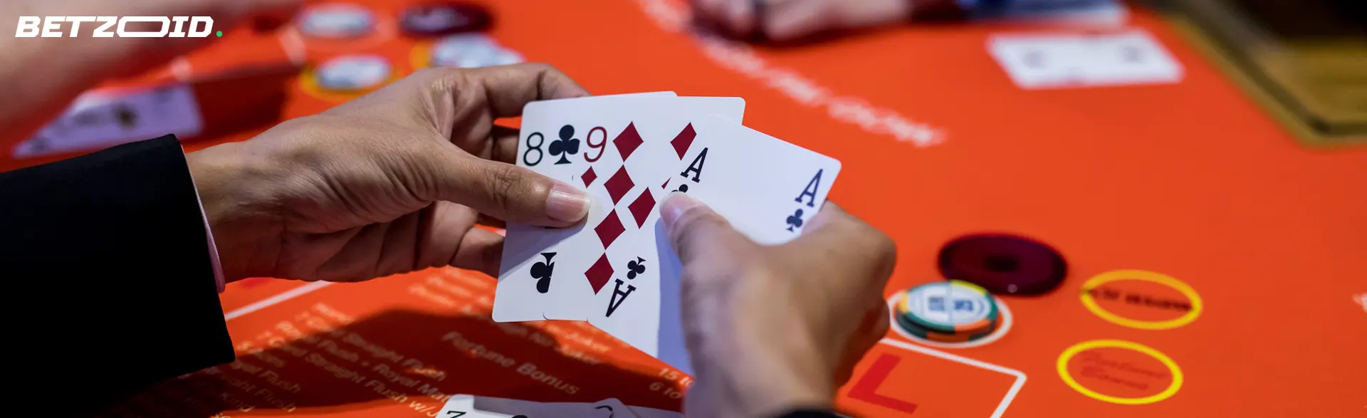 Playing cards in the player's hands.