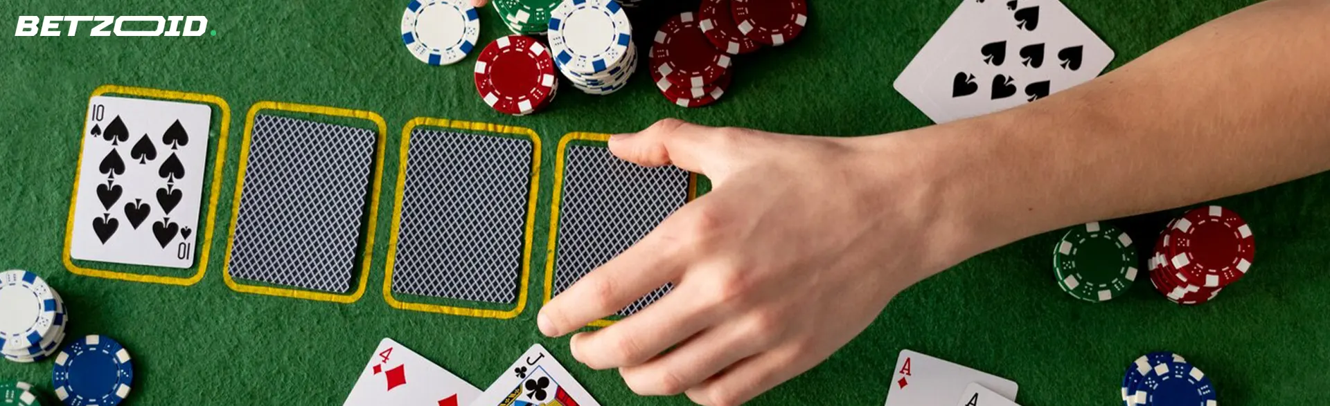 The player lays the cards on the casino table.