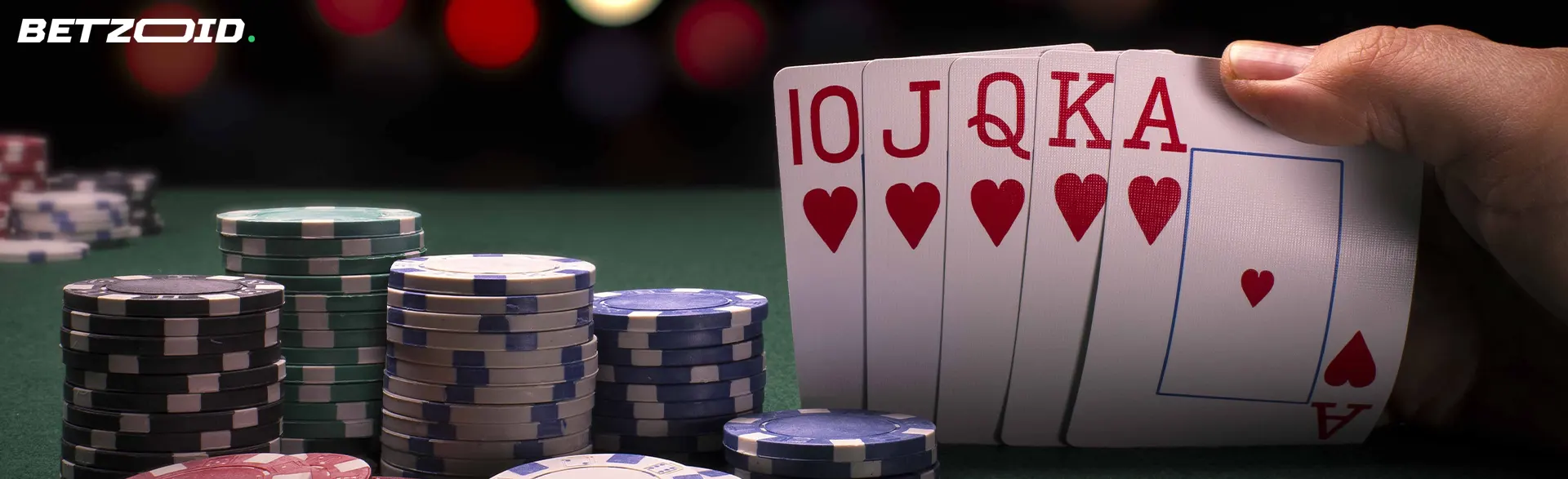 The cards are in the hands of the player next to the casino chips.